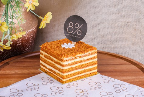 Layered cake with branded product presentation photographed for the company profile