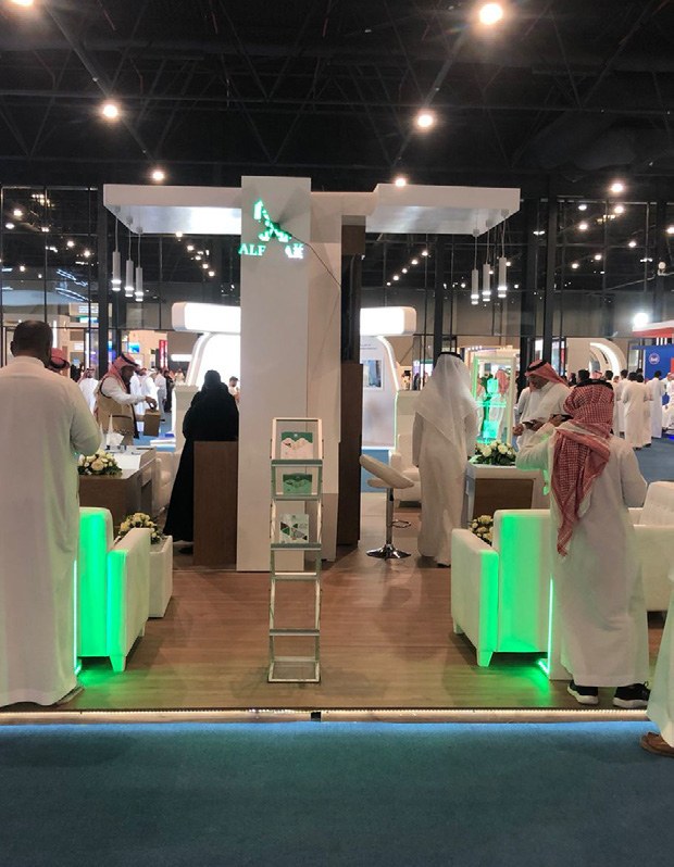 Exhibition stand with illuminated brand elements from the company profile