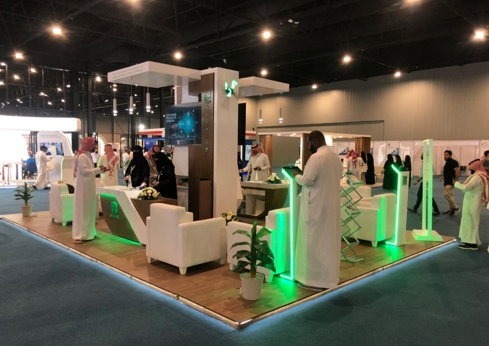 Upright photograph of an illuminated exhibition booth from the Basma company profile