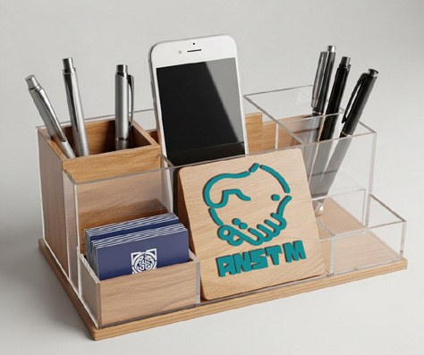 Custom branded desktop organiser shown in the Basma Paradise company profile